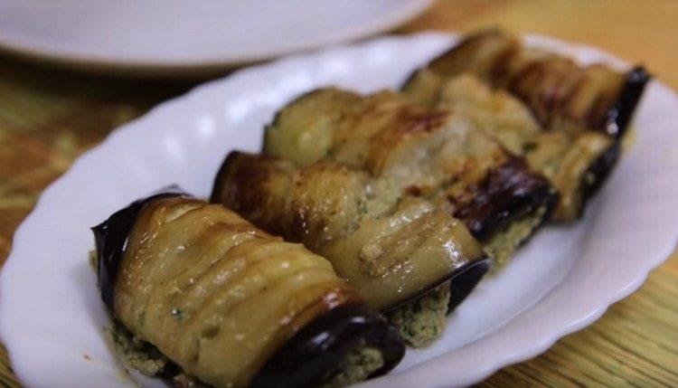 We lay eggplant on a serving dish.
