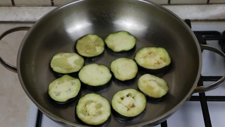 Fry the eggplant to cook.