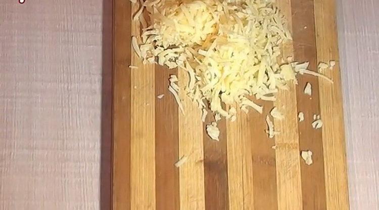 Grate cheese to cook
