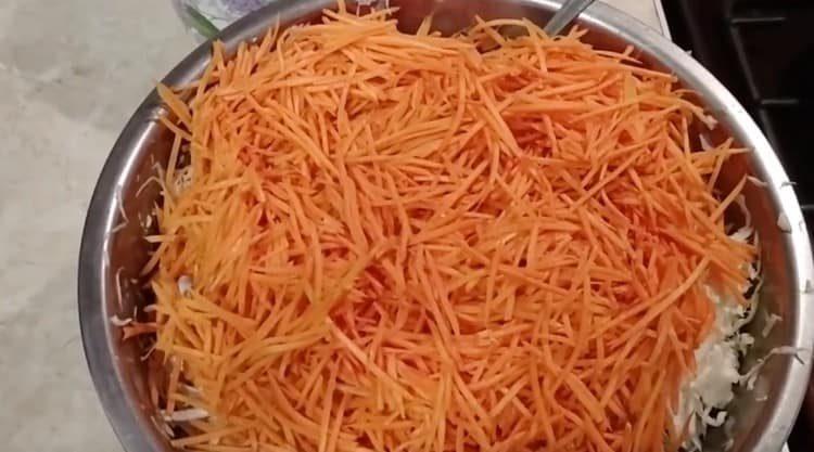 Add the carrots to the cabbage.