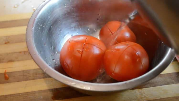 pour tomatoes with boiling water