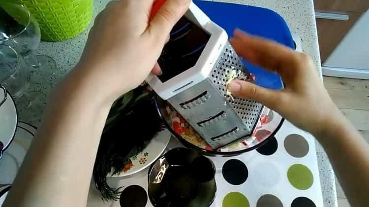 Grate garlic to cook