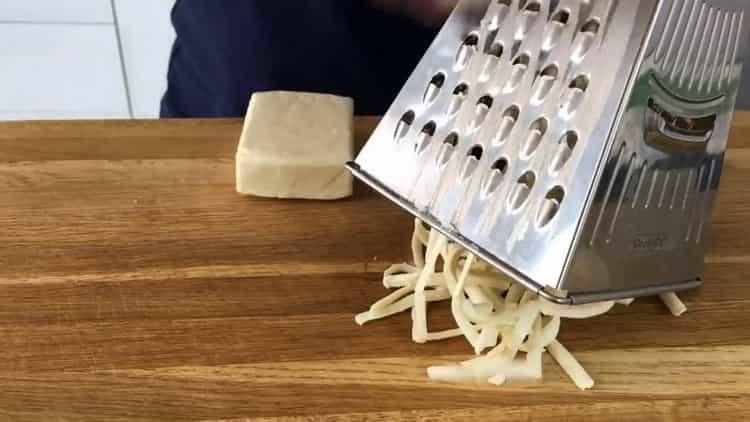 Grate cheese to cook