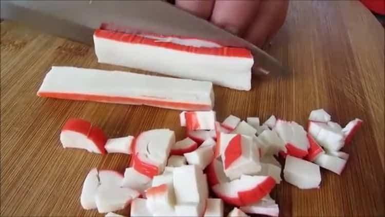 To make a salad, cut crab sticks