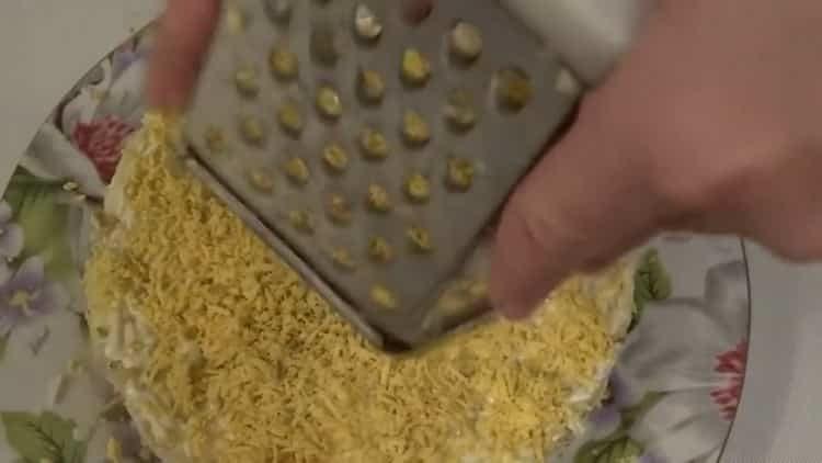 To prepare the dish, grate the yolks