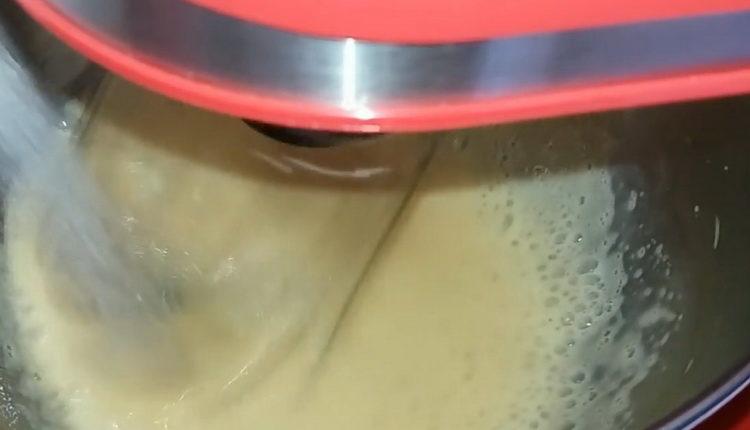 Mix the ingredients to make the cake.