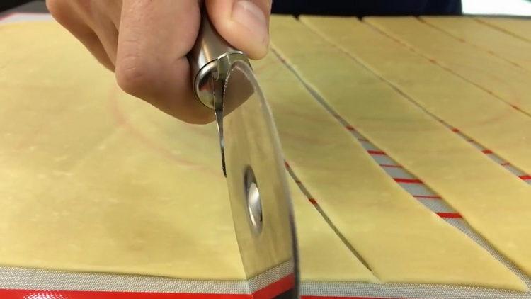 To prepare the dish, cut the dough