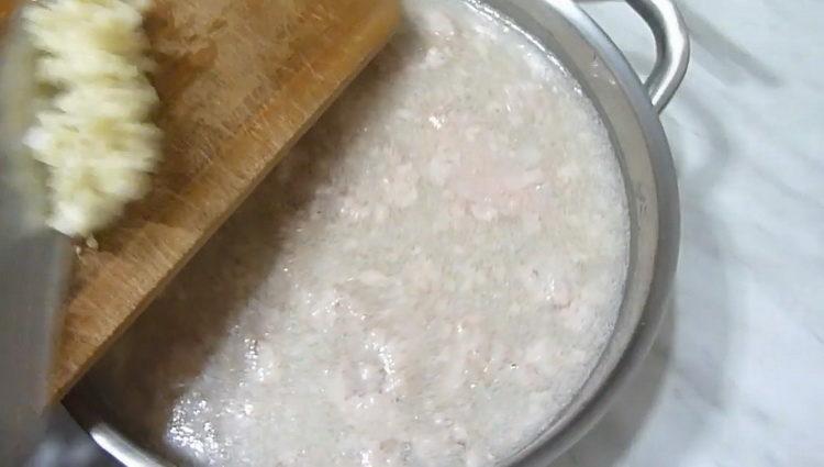 Grate garlic to cook