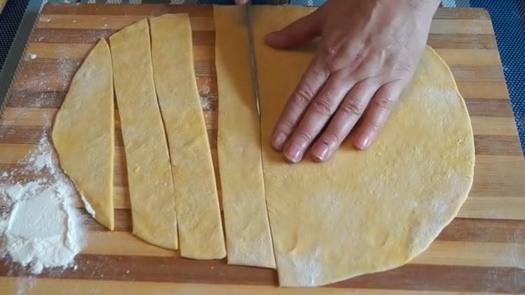 To prepare the dish, cut the dough