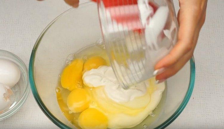 Cooking sour cream and egg for casserole.