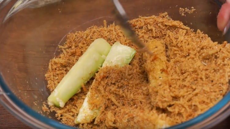 roll the zucchini in flour, then in the egg and breading.