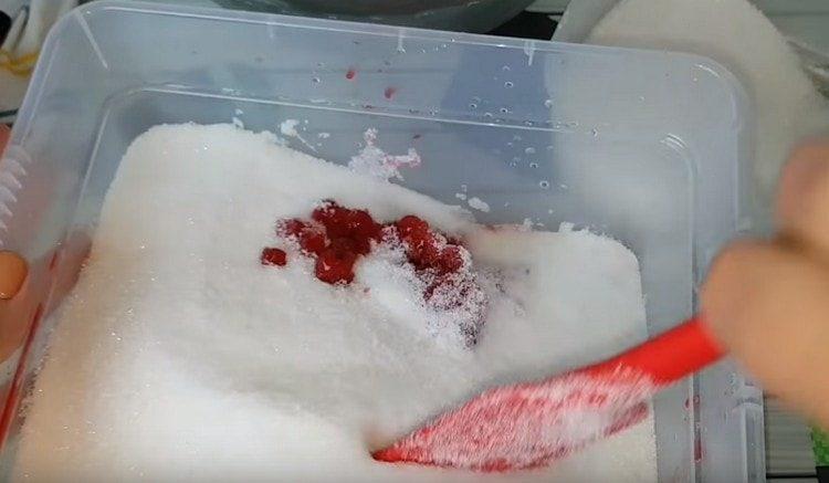 Add half the sugar to the berries and mix.