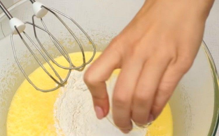 In parts, we introduce flour with baking powder.