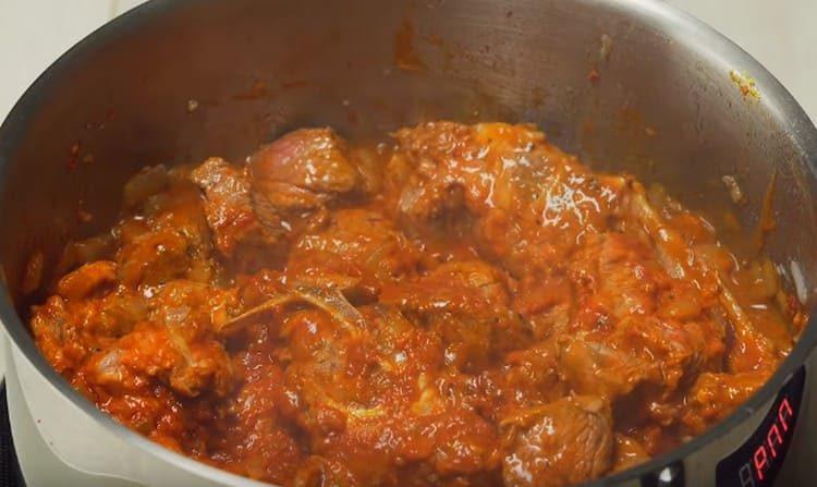 Next, add spices and tomato paste.