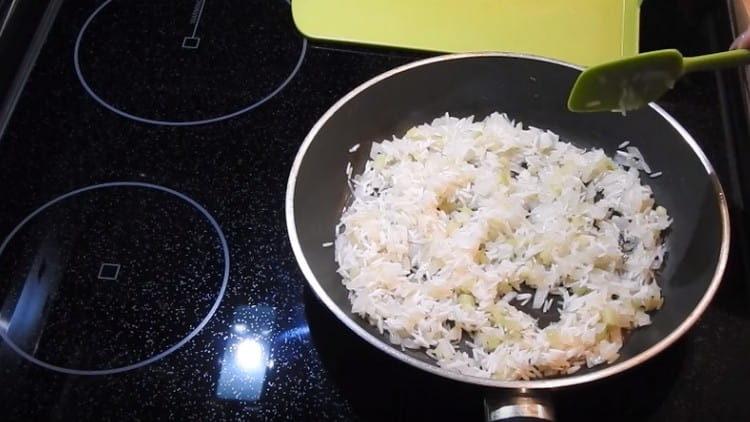Add rice to the pan, mix.