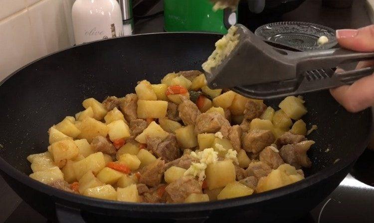 Pass the roast garlic through the press.