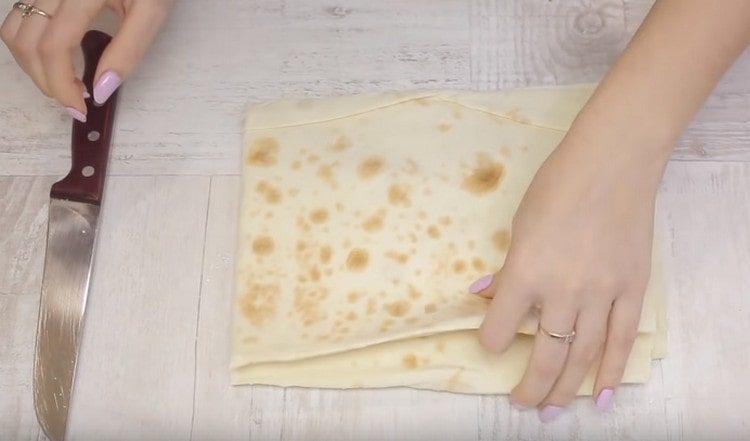 Cut the pita bread into squares.