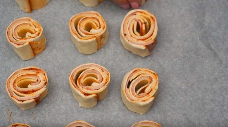 put portions of the roll on a baking sheet covered with parchment.