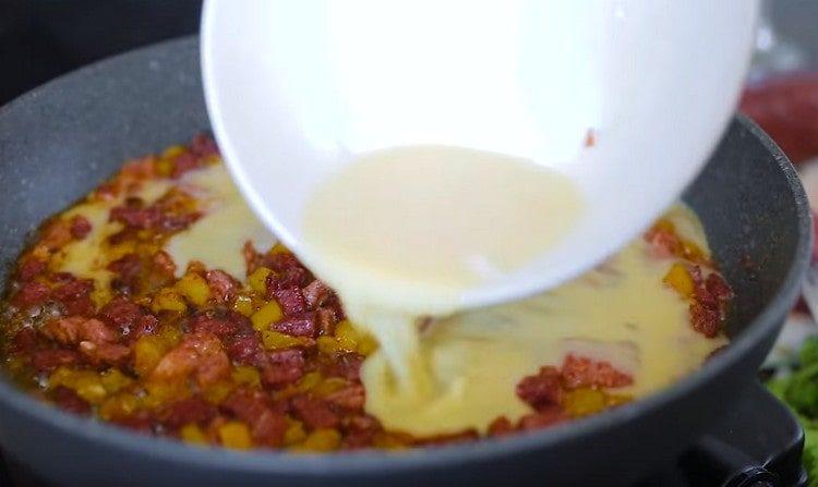 Beat the eggs and pour into the pan.