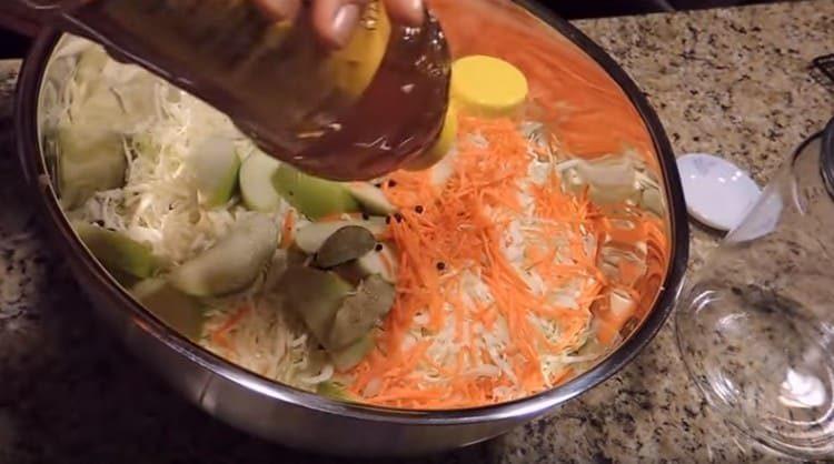 Add salt, peppercorns, bay leaves to the cabbage.