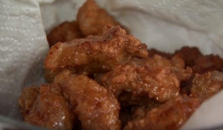 We shift the finished meat to napkins.