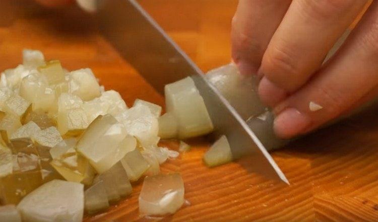 Dice pickled cucumber.