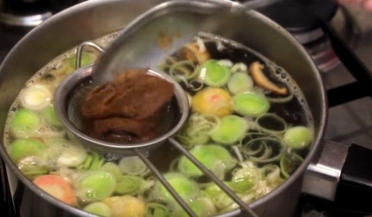 In an almost ready soup, dissolve the miso paste.