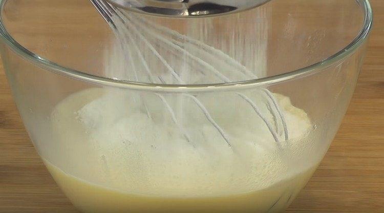 Sift the flour and mix the dough.