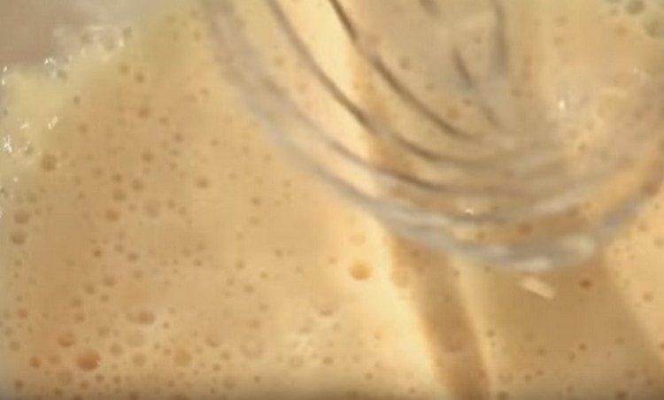 Add flour and whisk mix batter.