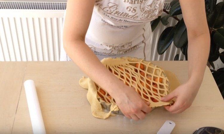 Gently transfer the cut out dough onto the pie and pinch the edges.