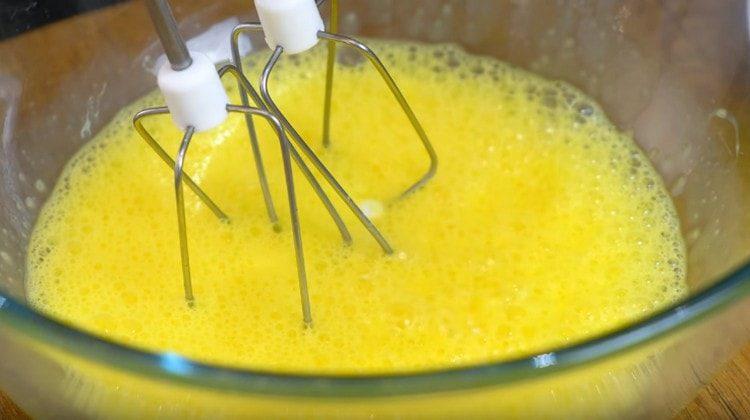 Beat eggs with a mixer.