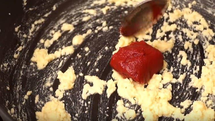 Add tomato paste to the flour.
