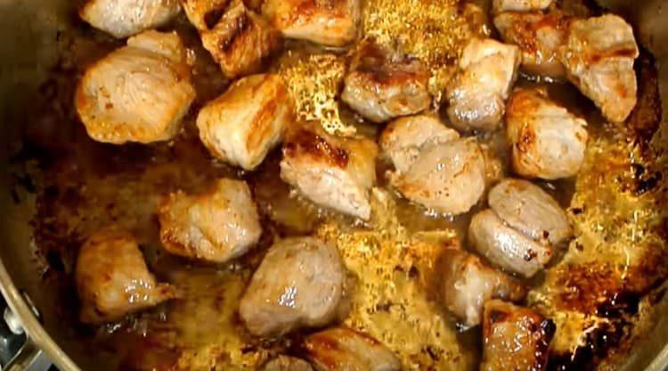 Fry the meat until golden brown.