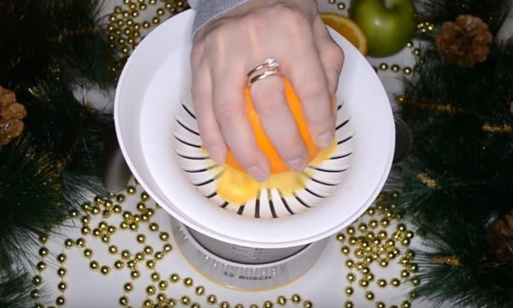 Squeeze the juice from one half of an orange.