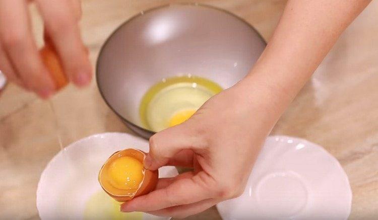 Knock out one egg and another yolk in a bowl.