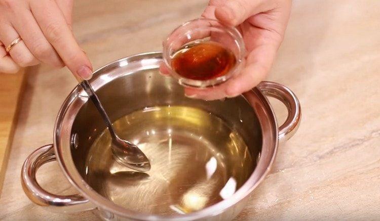 Add the dark rum to the cooled syrup.