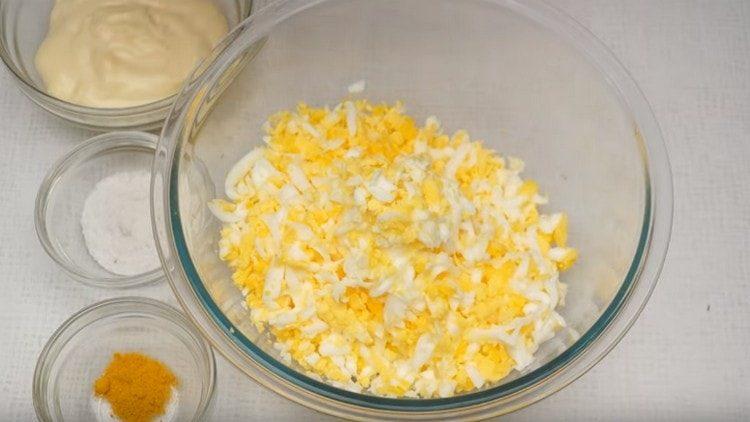 grate hard-boiled eggs.