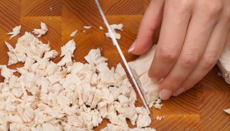 chop the boiled chicken fillet.