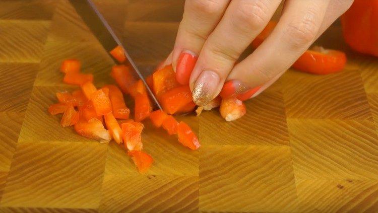 Finely chop the red bell pepper.