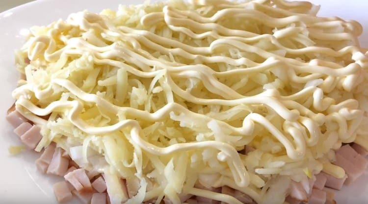 then grate the boiled potatoes, make a mayonnaise grid.