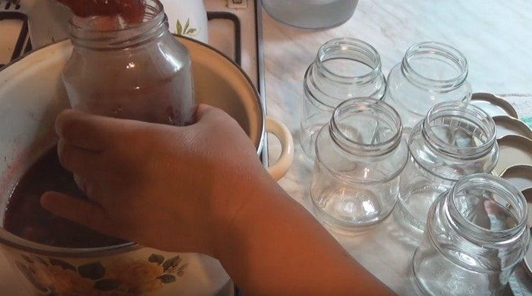 We boil jam for the third time and pour into sterilized jars.