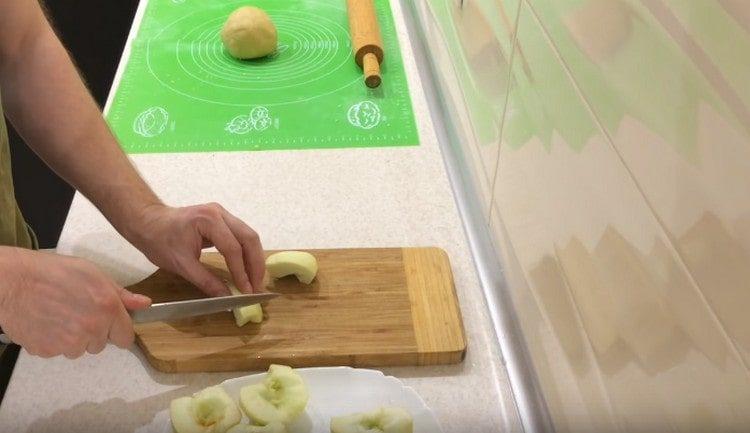 Cut apples into pieces.