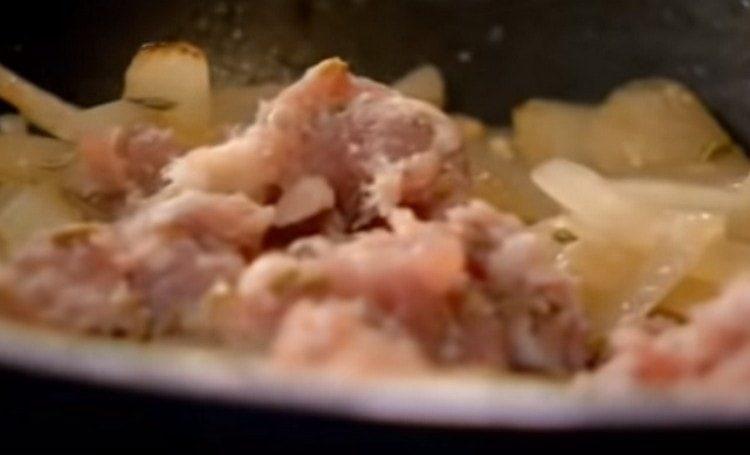 Add homemade sausages to the onion.