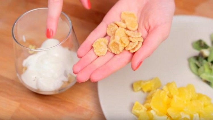 sprinkle some cornflakes on top of the yogurt.