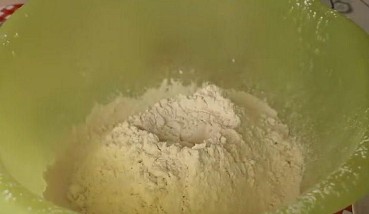 Sift flour into a bowl for kneading dough.