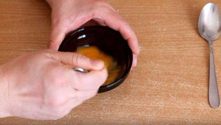 Beat the egg with a fork.