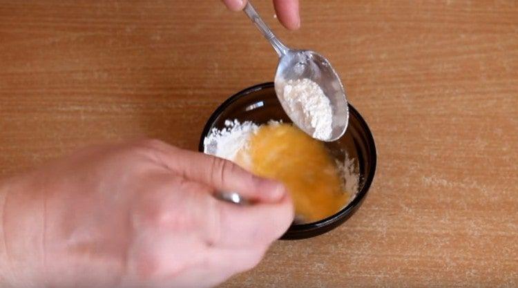 Add the flour and mix the batter.