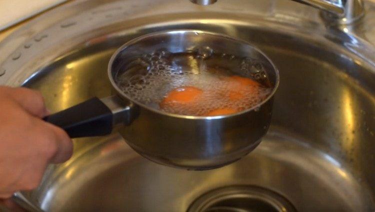 After cooking, fill the eggs with cold water.