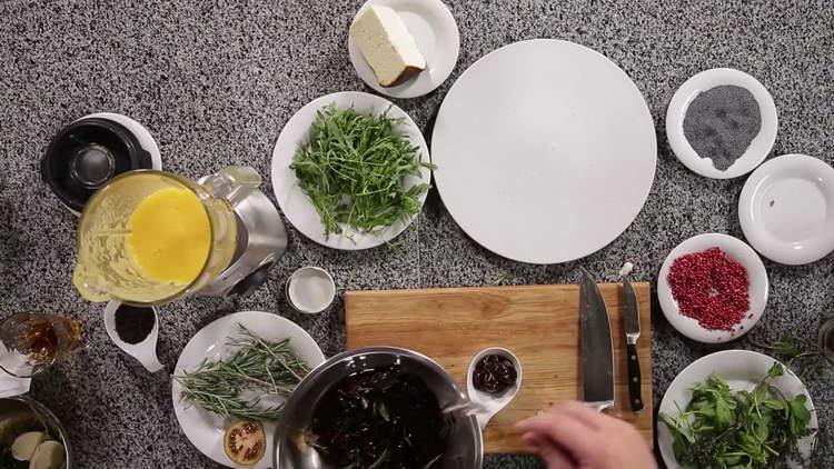  put plums with rosemary in a bowl