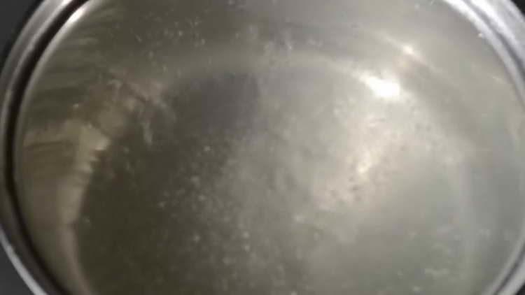 pour water and spices into the pan